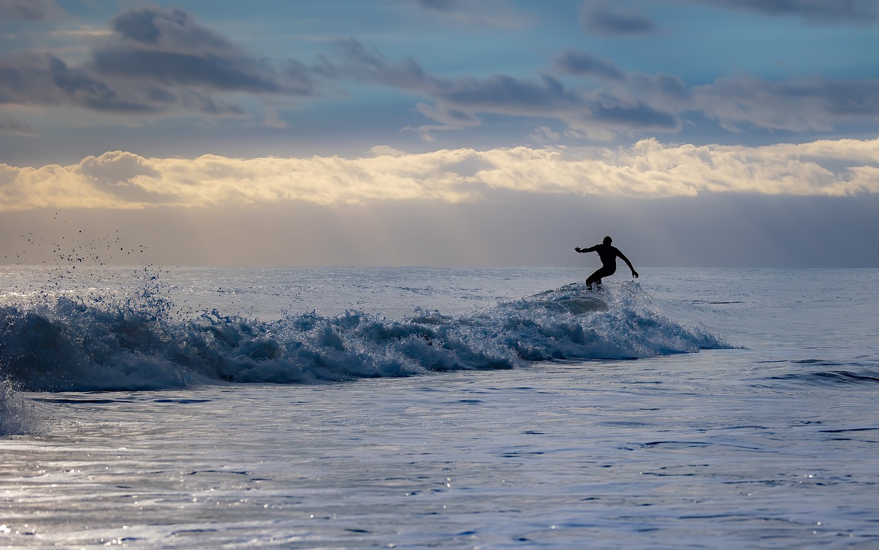 One of the best things to do in Tofino, BC is surfing the waves.