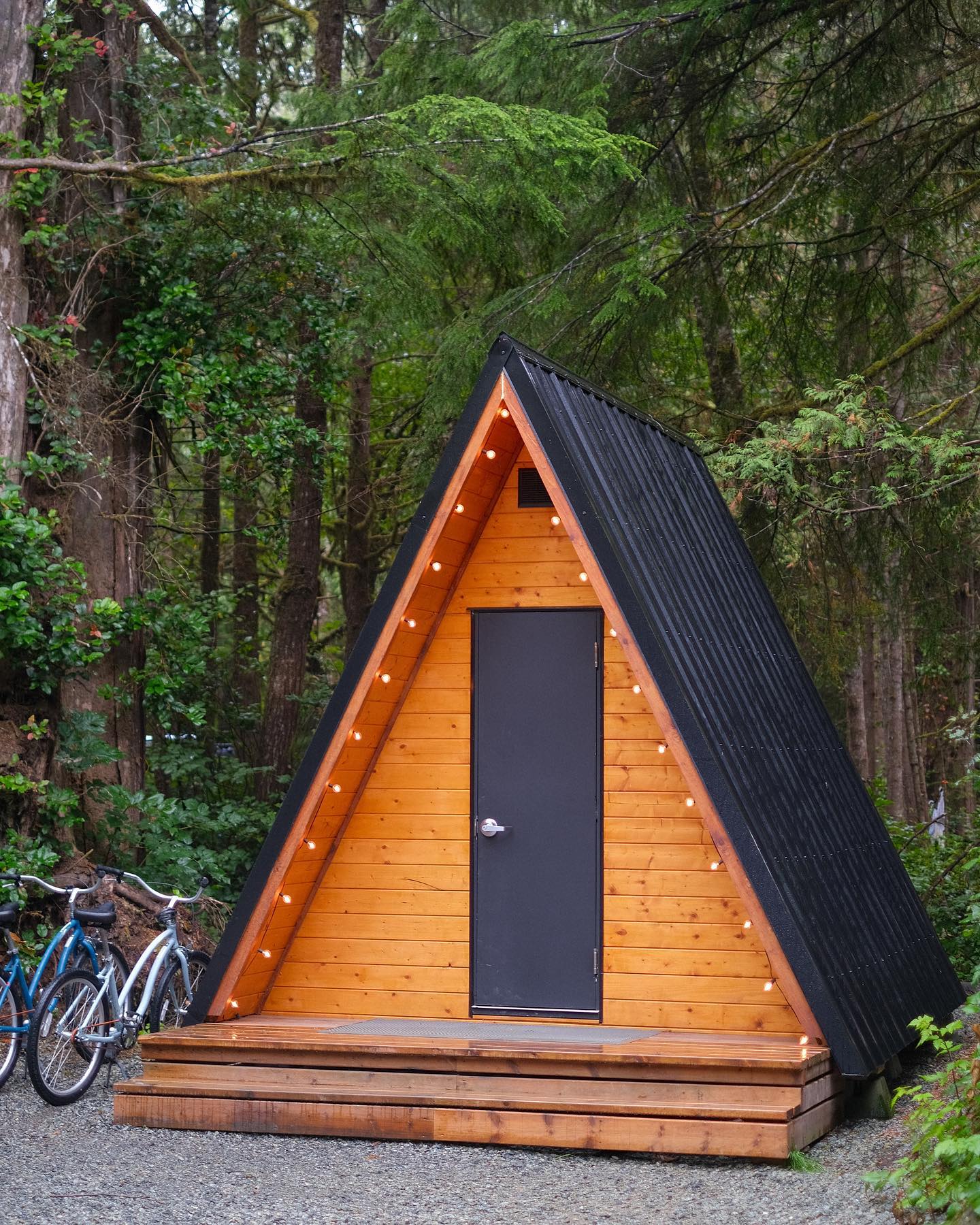 The simple A-frame cabins at Surf Grove Campground in Tofino