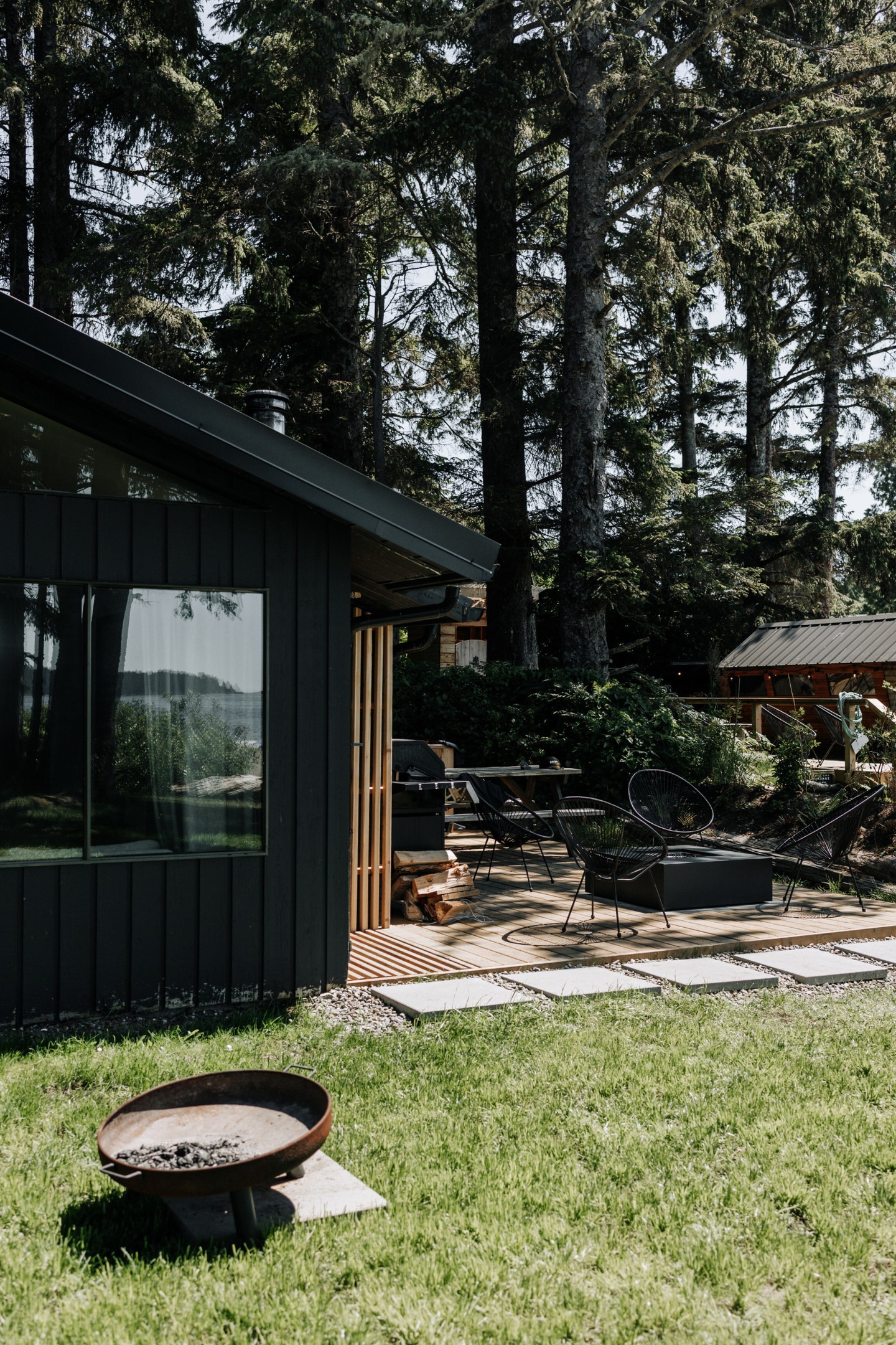 The newly updated black cabins with fire pits at the Mackenzie Beach Resort in Tofino